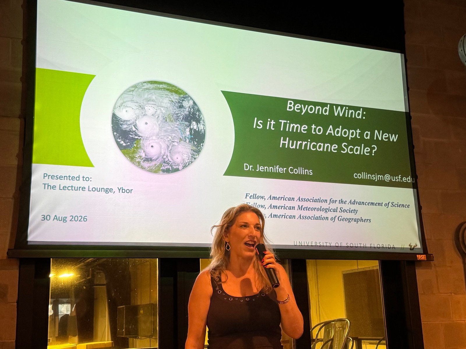Dr. Jennifer Collins presenting on the hurricane scale at The Lecture Lounge